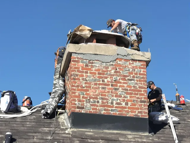 La Puente Chimney Sweep installing a custom chimney crown in La Puente, CA